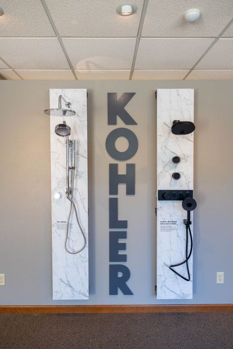 Kohler Shower System Display | Horsch & Miller Slinger WI Kohler shower system display featuring chrome and matte black showerheads and controls